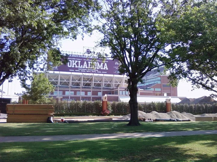 Commercial pressure washing service cleaning stadium bleachers and concrete seating in Norman Oklahoma