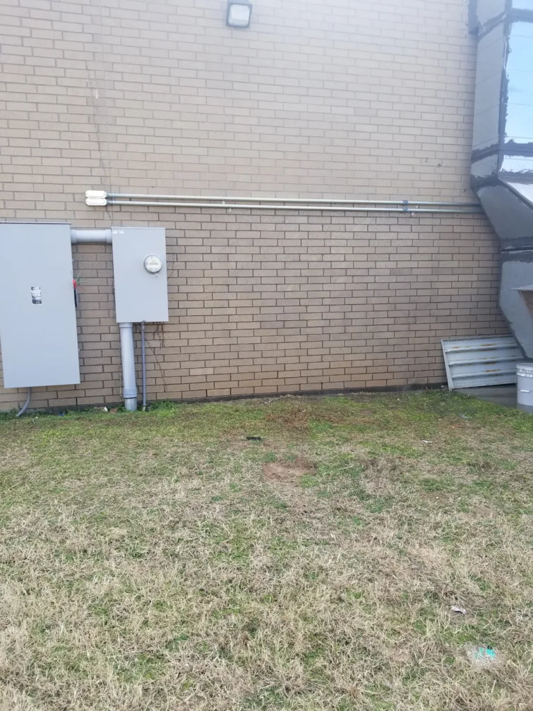 Commercial graffiti removal service cleaning spray paint off brick wall in Oklahoma City OK - After clean result