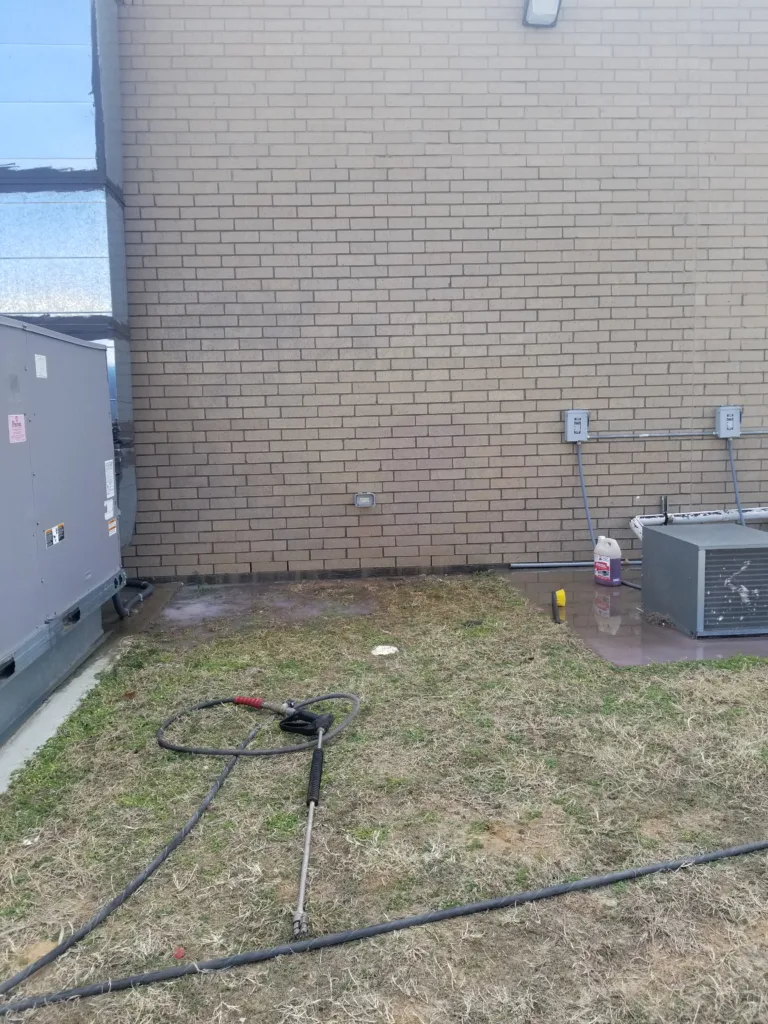 Graffiti removal service cleaning spray paint off brick wall in Oklahoma City OK - After clean result