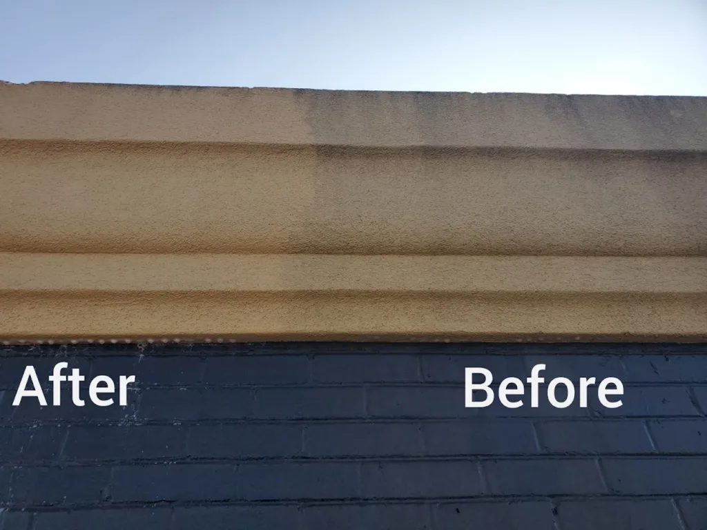 Soft washing Dryvit exterior siding on a commercial building OKC