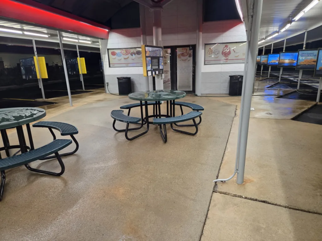Commercial pressure washing service cleaning outdoor restaurant patio seating area