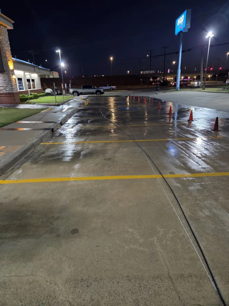 Commercial pressure washing service cleaning commercial concrete parking stalls