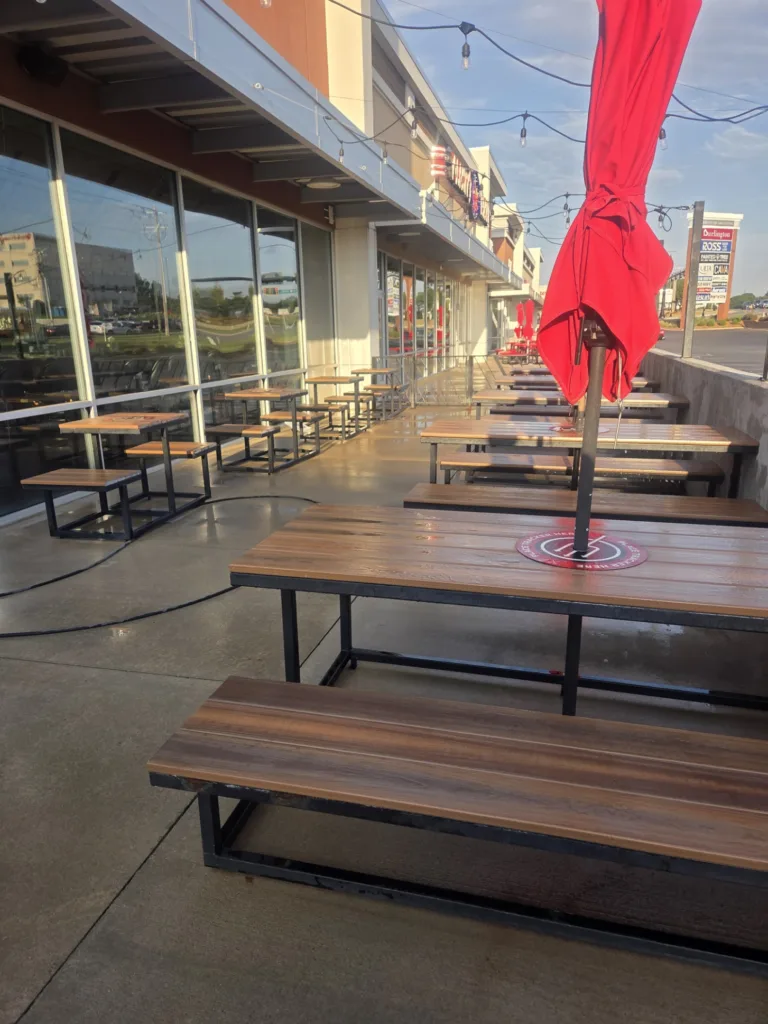 Professional pressure washing of commercial outdoor patio seating area in Edmond OK