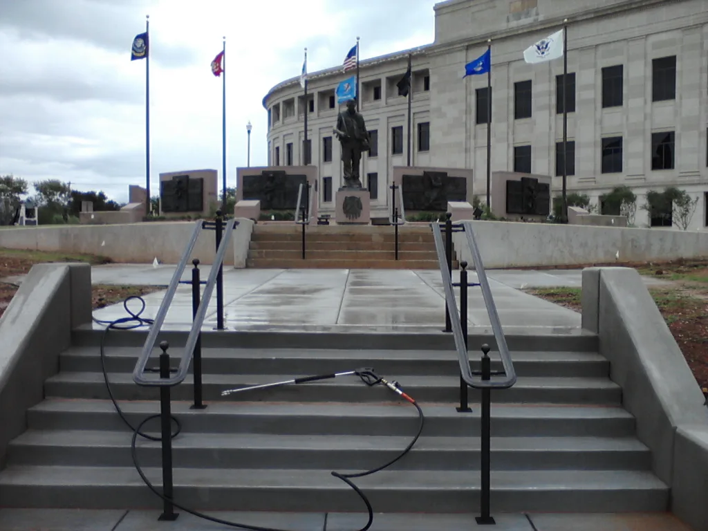 Commercial concrete cleanup after railing installation