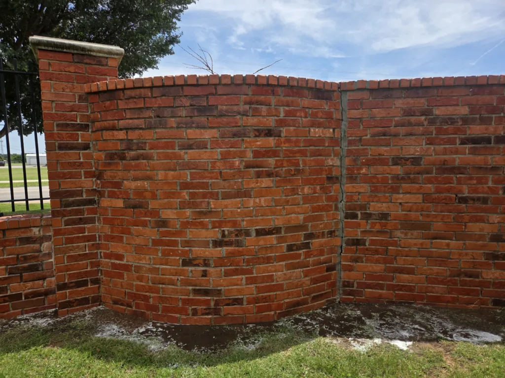 Graffiti removal service cleaning spray paint off brick wall - After clean result