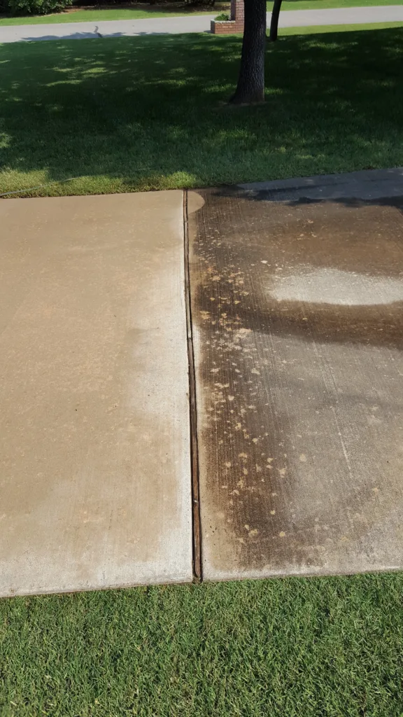 Pressure washing concrete driveway in Edmond OK before and after