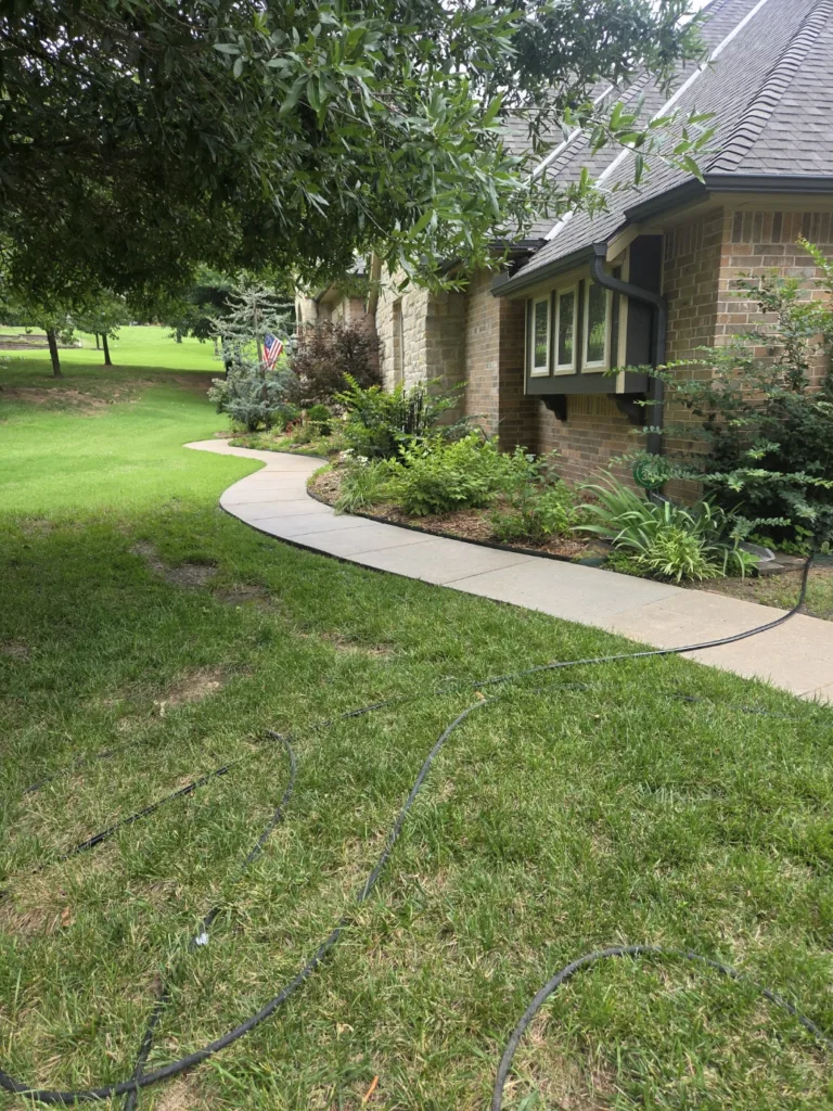 Residential pressure washing service cleaning concrete sidewalk in Choctaw Oklahoma After